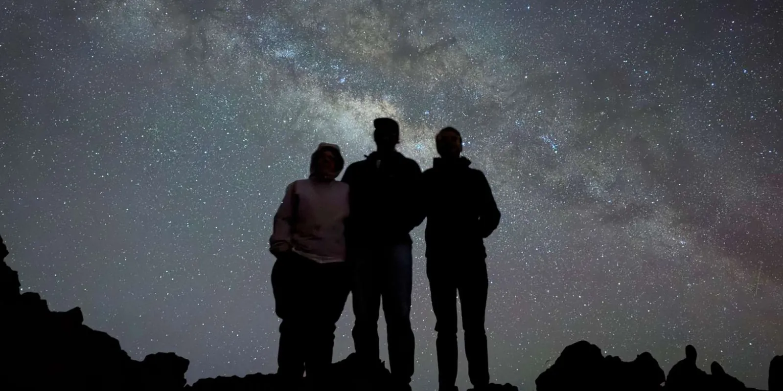 Star cluster viewed through telescope guided by a Native Hawaiian astronomer